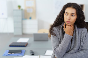 real estate agent sitting at desk